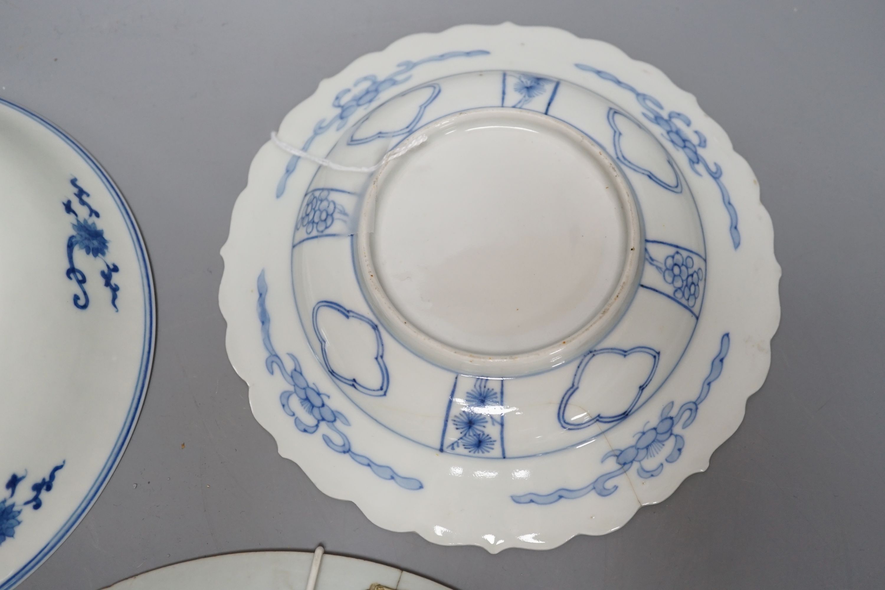 Three Chinese plates including a 19th century Chinese Imari dish, 23cm - repaired, a Chinese famille rose crackleglaze vase, 29cm, together with a famille rose teapot and a crackleglaze celadon ground bottle vase. Talles